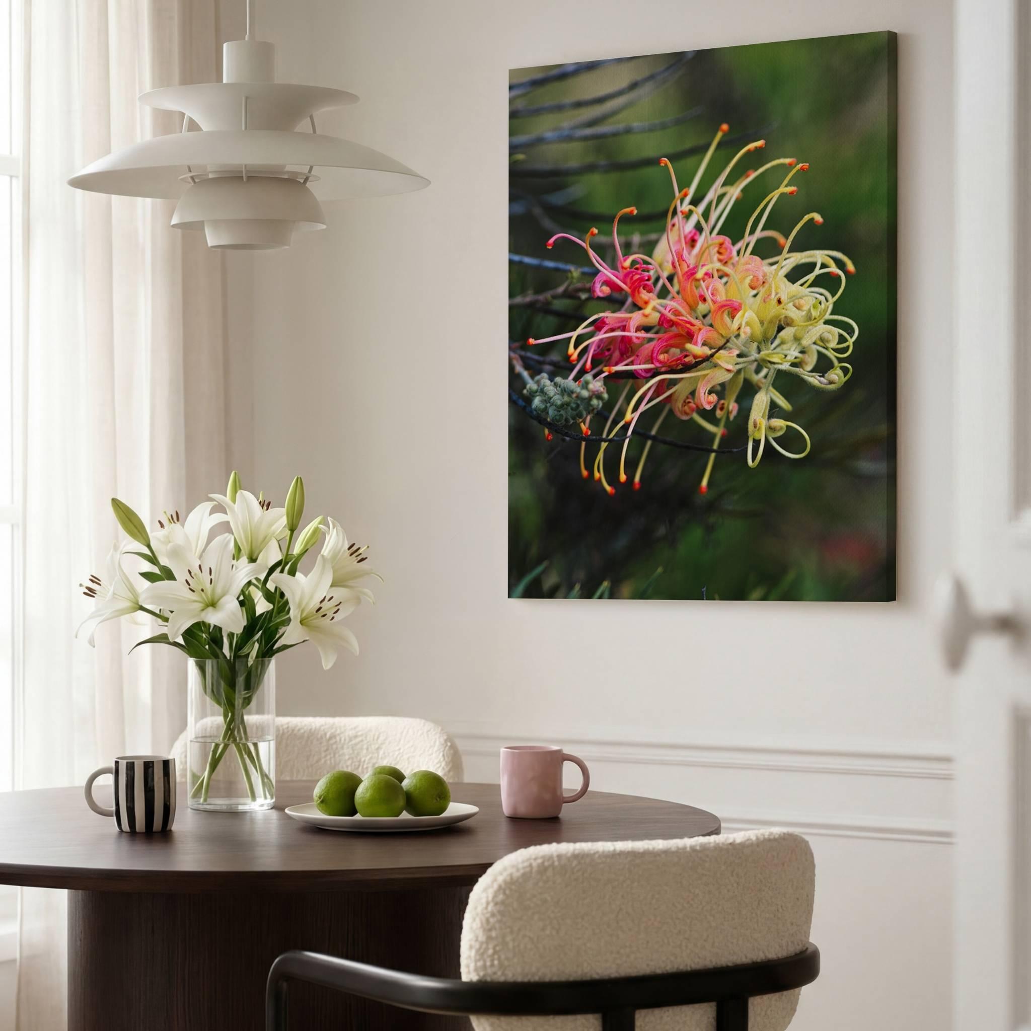 Grevillea Peaches and Cream canvas print displayed in a bright modern dining room with a walnut table, white lilies, Scandinavian pendant light, and neutral décor by Abigail Diane Photography.