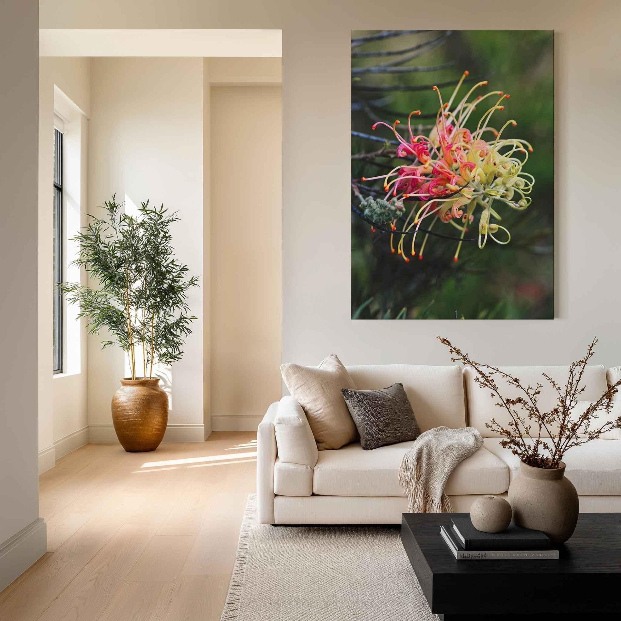 Grevillea Peaches and Cream canvas print displayed above a cream sofa in a modern neutral living room with natural wood accents, soft textiles, and botanical décor by Abigail Diane Photography.