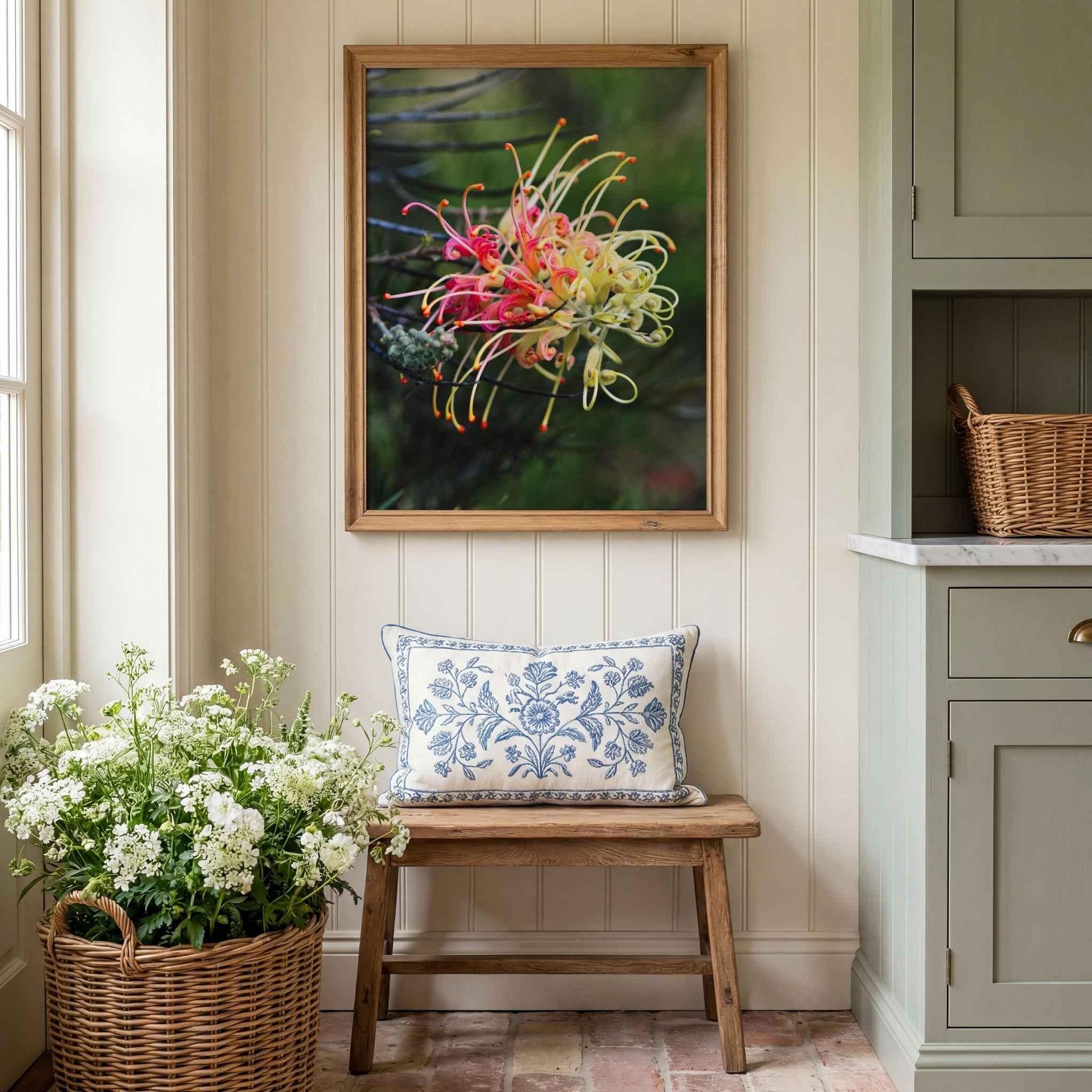 Grevillea Peaches and Cream fine art print in a natural oak frame displayed above a rustic wooden bench with fresh white flowers and cottage-inspired décor by Abigail Diane Photography.