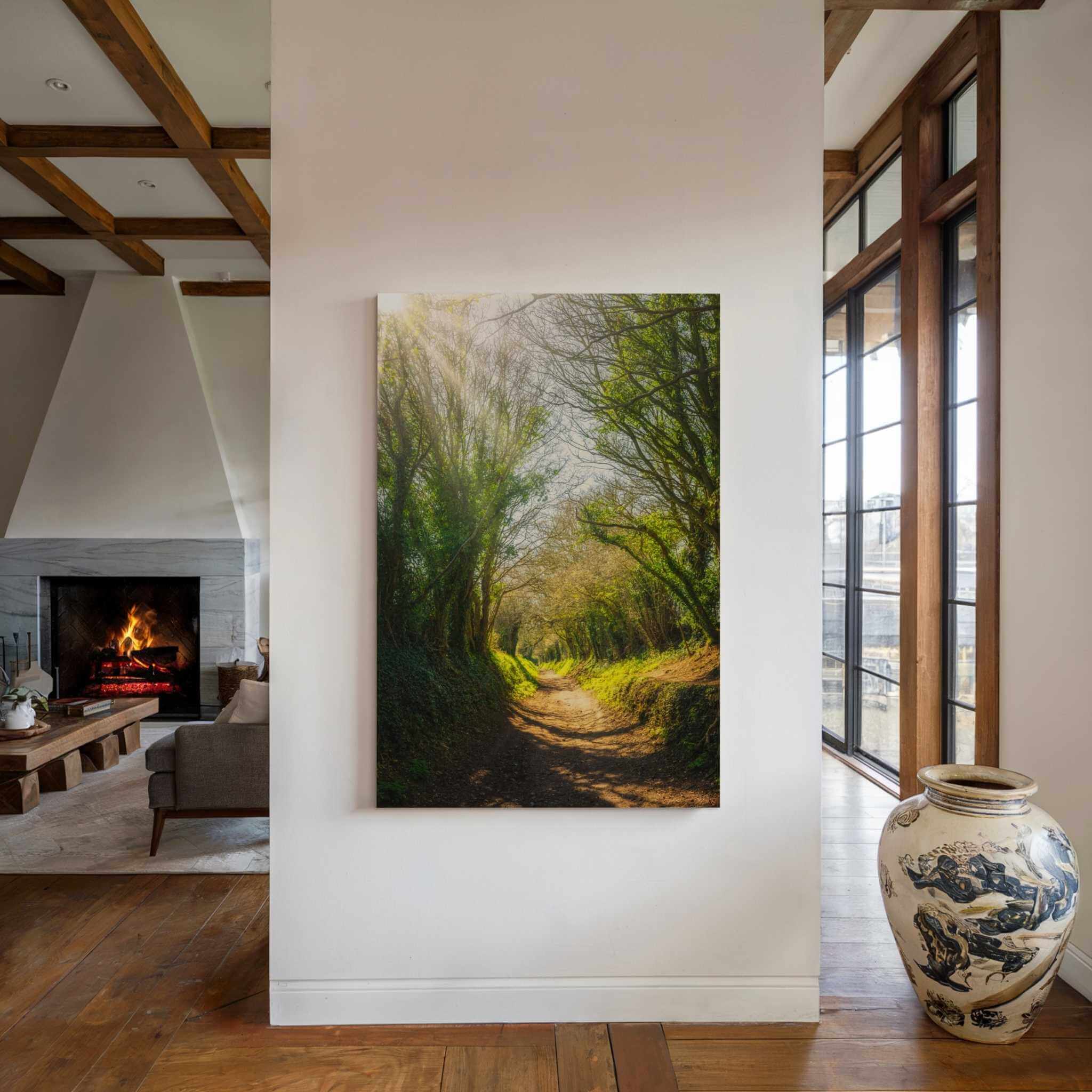 Museum-quality canvas print of Halnaker Tree Tunnel in West Sussex, United Kingdom, adding peaceful woodland scenery to a modern home interior. Photographed by Abigail Diane Photography