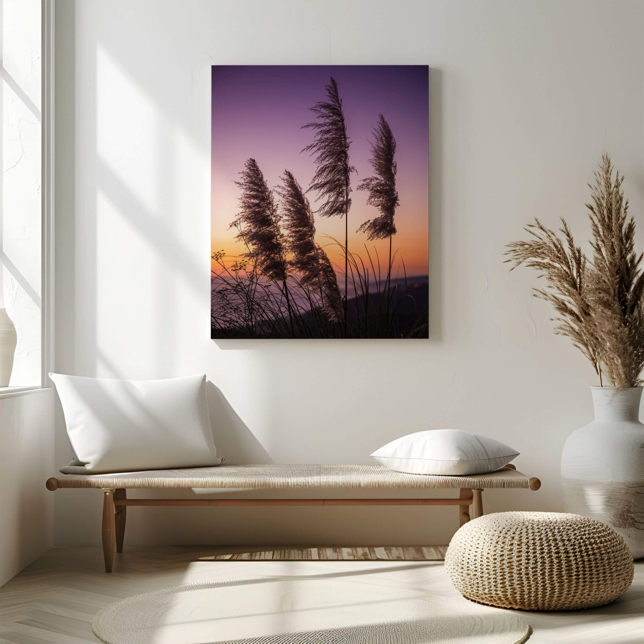 Laguna Beach sunset metal print featuring windswept pampas grass and purple orange skies displayed in a calm neutral nature-inspired interior.