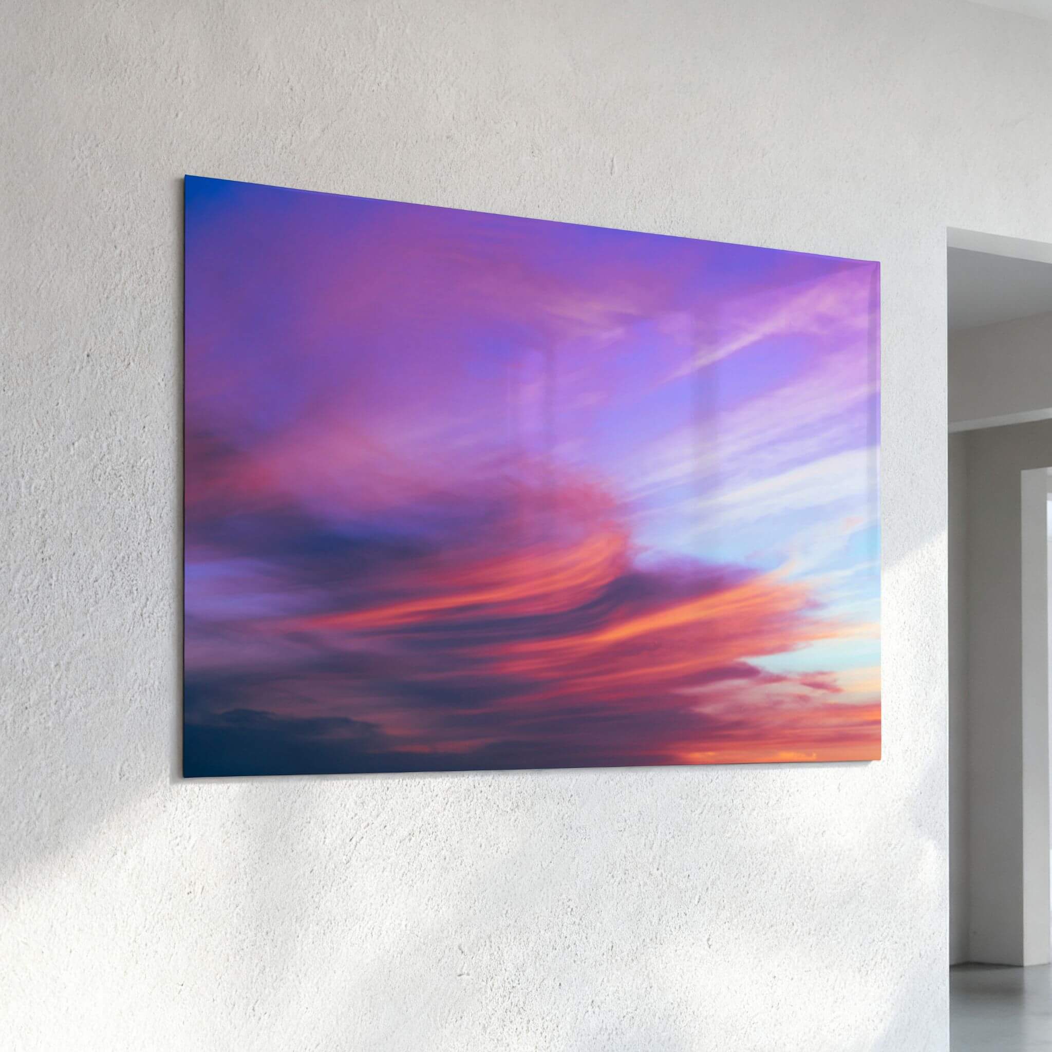 Lavender Dreams contemporary HD metal wall art displayed in a bright modern interior, highlighting dramatic lavender, pink, coral, and blue sunset clouds by Abigail Diane Photography.