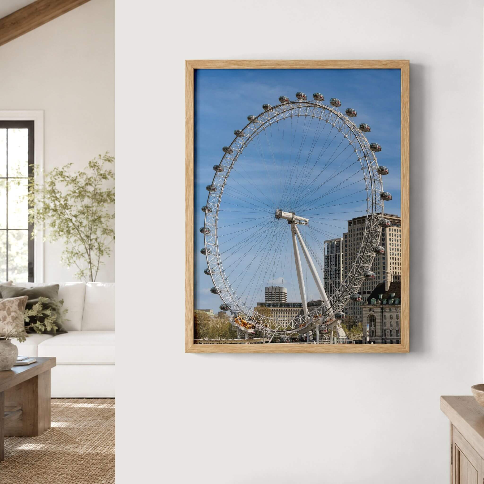 London Eye fine art print in a natural wood frame displayed as wall art in a warm neutral contemporary living space.