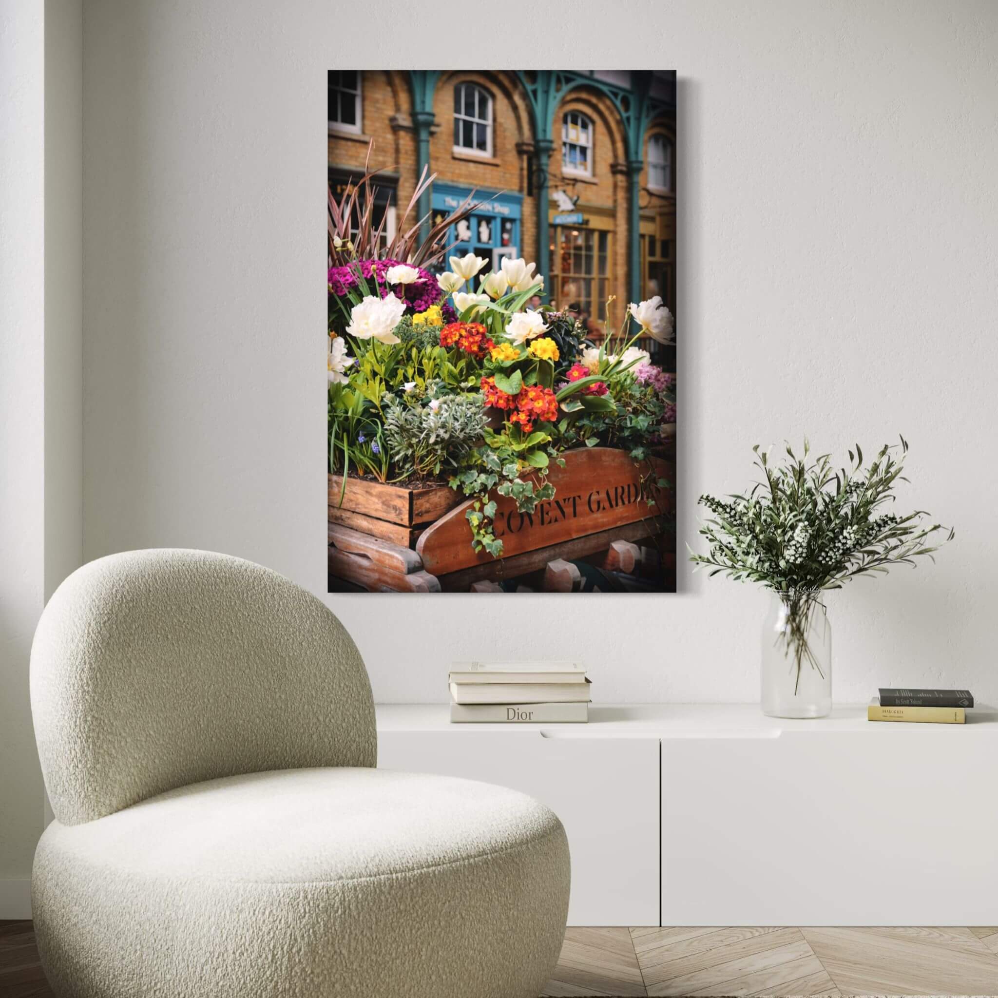 Covent Garden in Bloom fine art print displayed in a neutral reading nook with a white boucle chair and botanical accents.