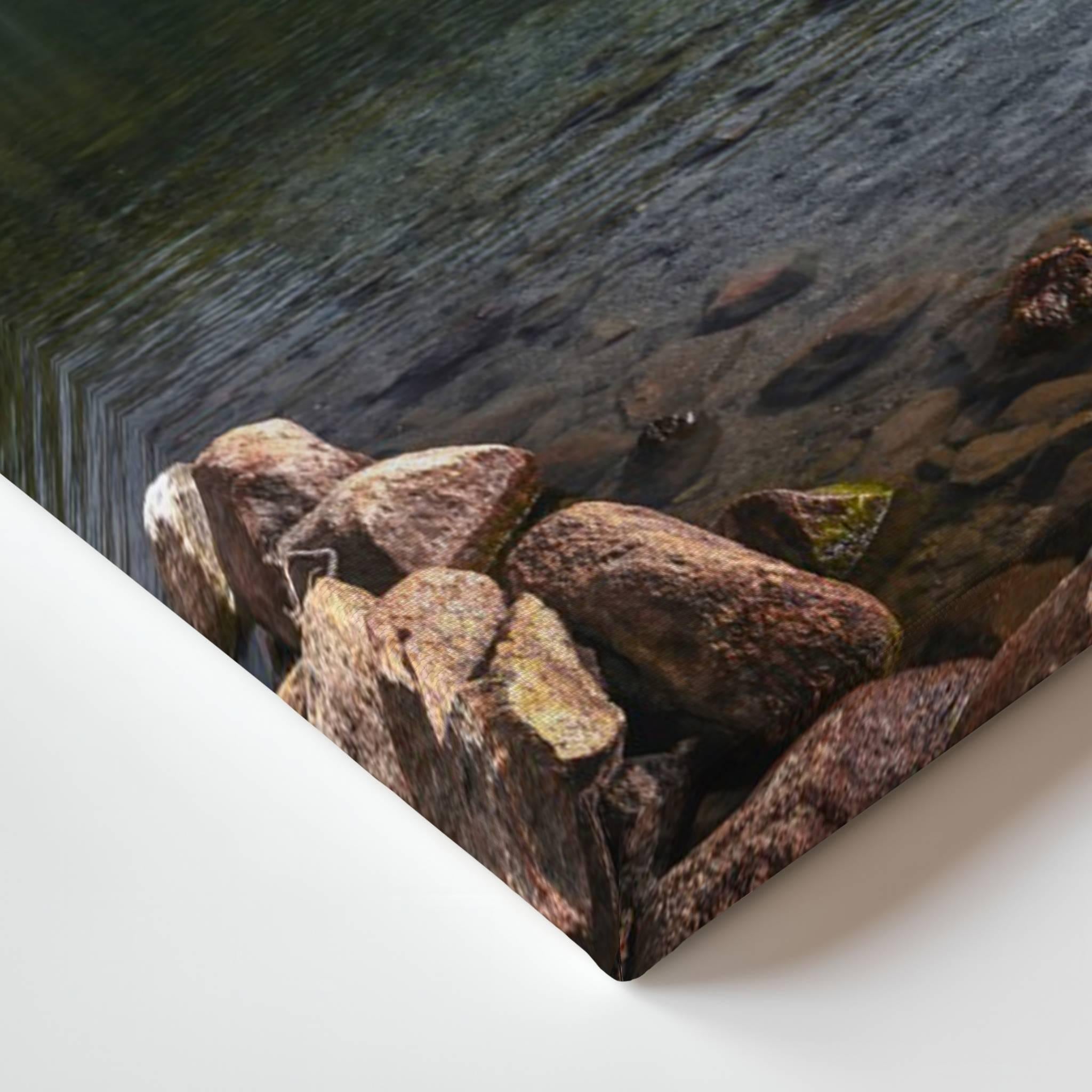Close-up of Reflections gallery-wrapped canvas corner showing deep blue ocean reflections and vibrant sunset colours wrapped around the canvas.