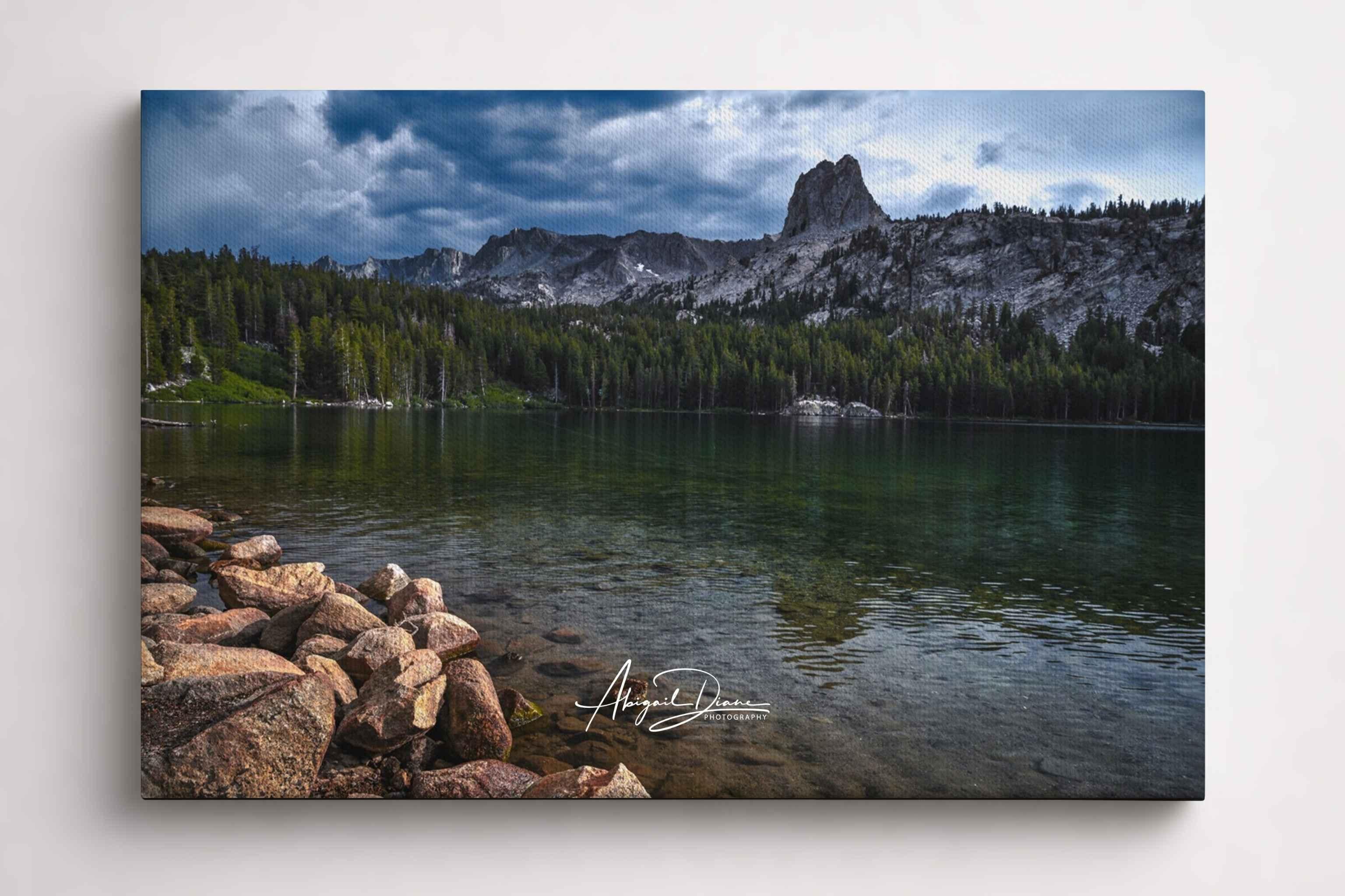 Reflections of Lake Mary, an alpine lake in Mammoth Lakes, California, with granite peaks, evergreen forest, and calm water reflecting the surrounding landscape. Gallery-wapped canvas print by Abigail Diane Photography.