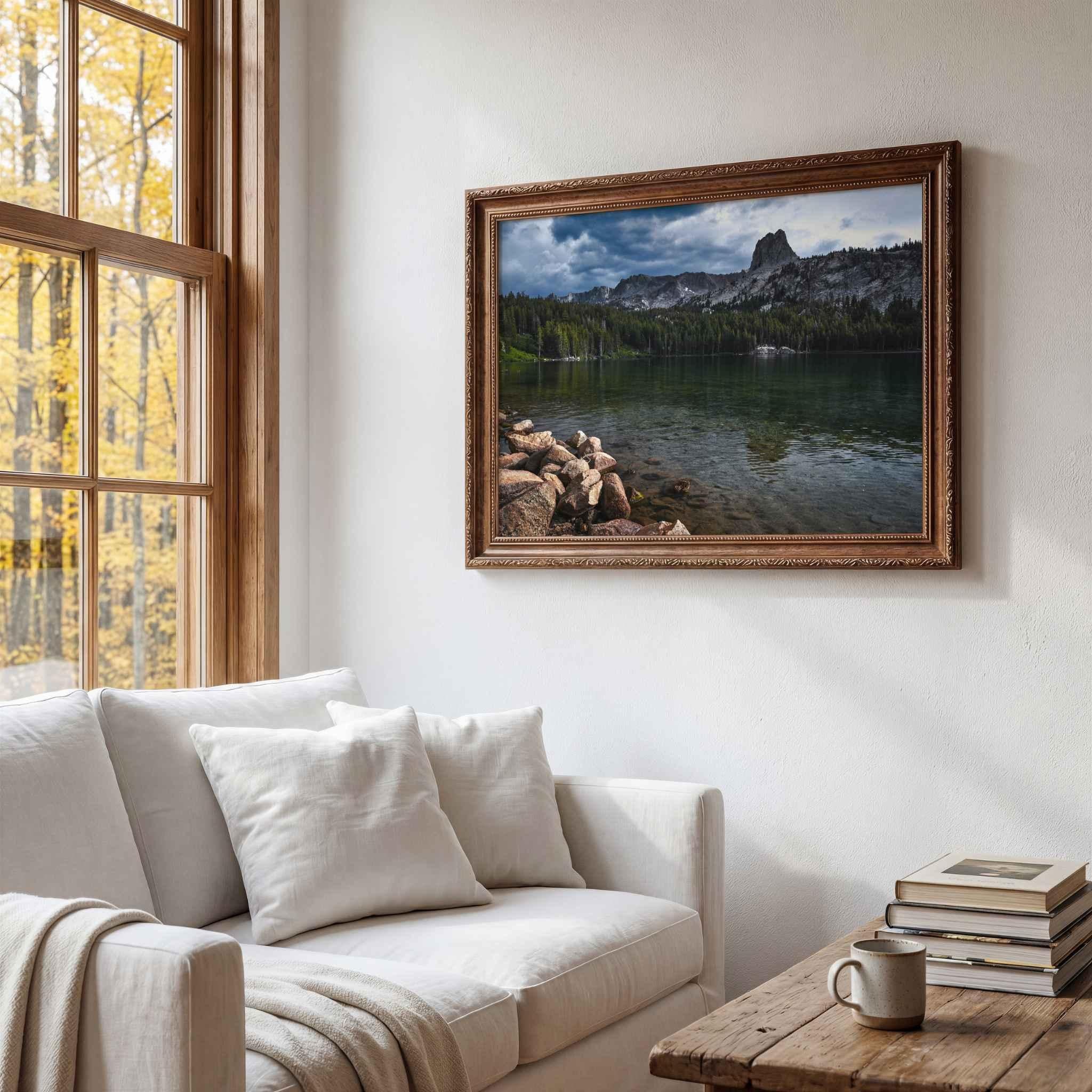  Reflections on Lake Mary landscape photography from Mammoth Lakes displayed in a traditional dark wood frame in a warm living room.