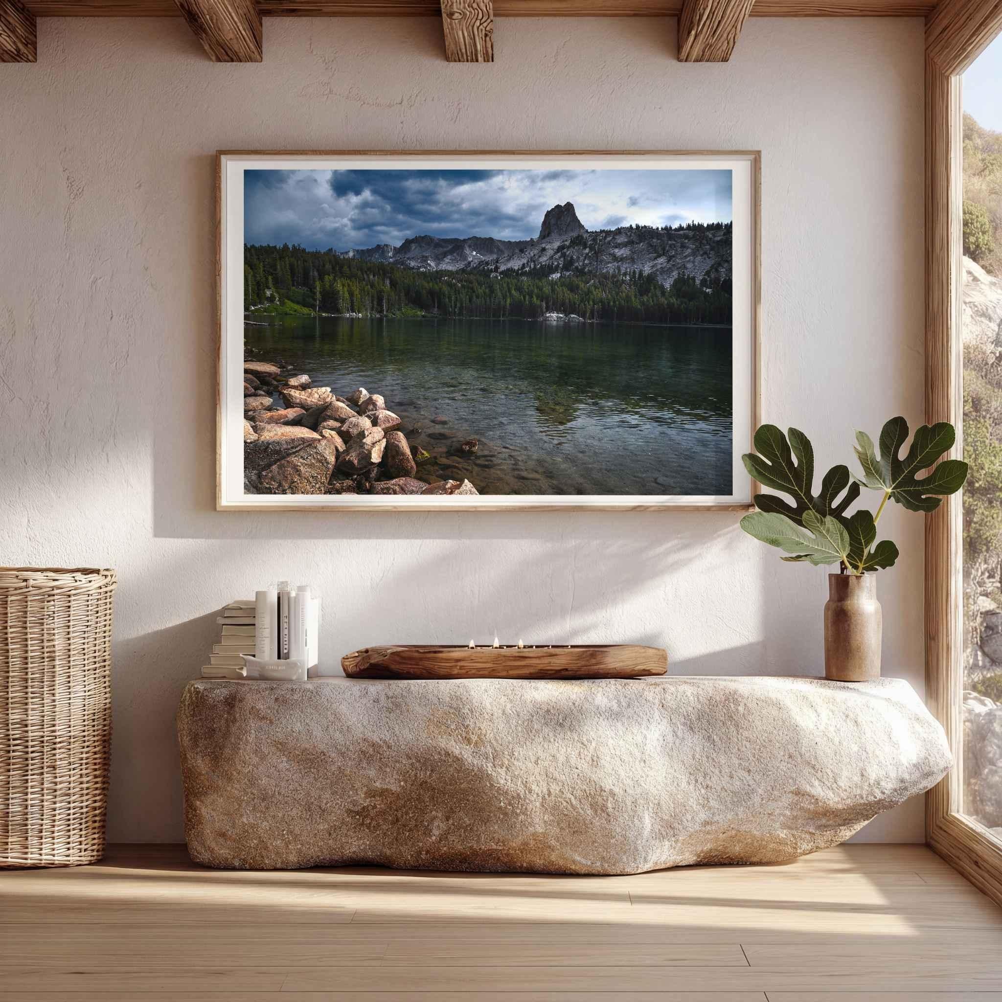 Matted Reflections on Lake Mary fine art print featuring the Eastern Sierra landscape displayed in a light wood frame above a stone console.