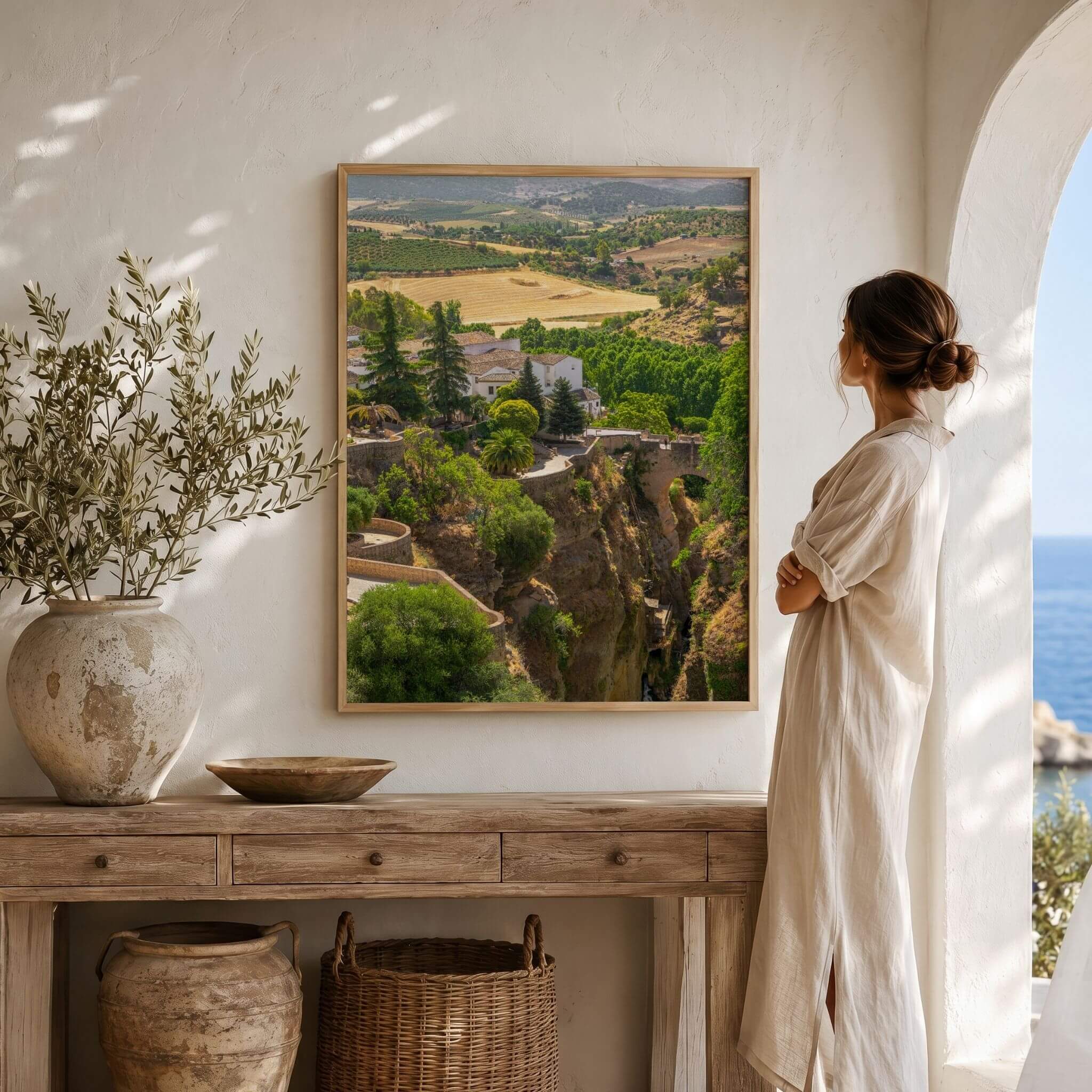Ronda Above the Gorge framed fine art print displayed in a warm Spanish-inspired interior, featuring El Tajo Gorge and the surrounding Andalusian landscape of Ronda, Spain – Abigail Diane Photography
