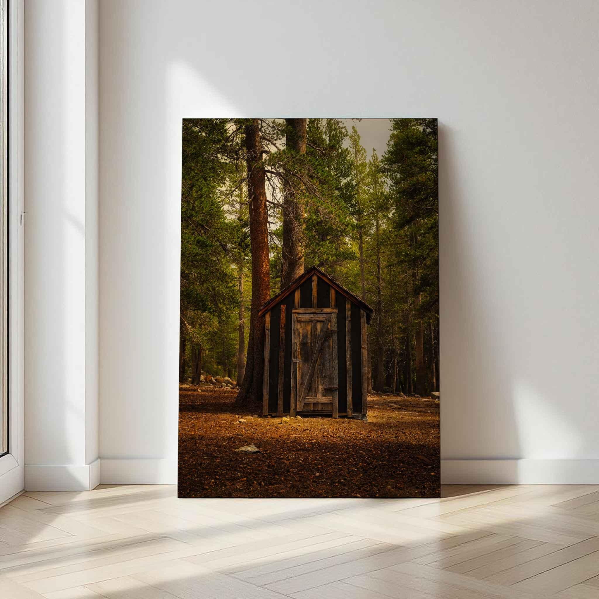 Rustic Remnant Among the Trees metal wall art showing an old wooden cabin surrounded by pine trees in Mammoth Lakes, California.