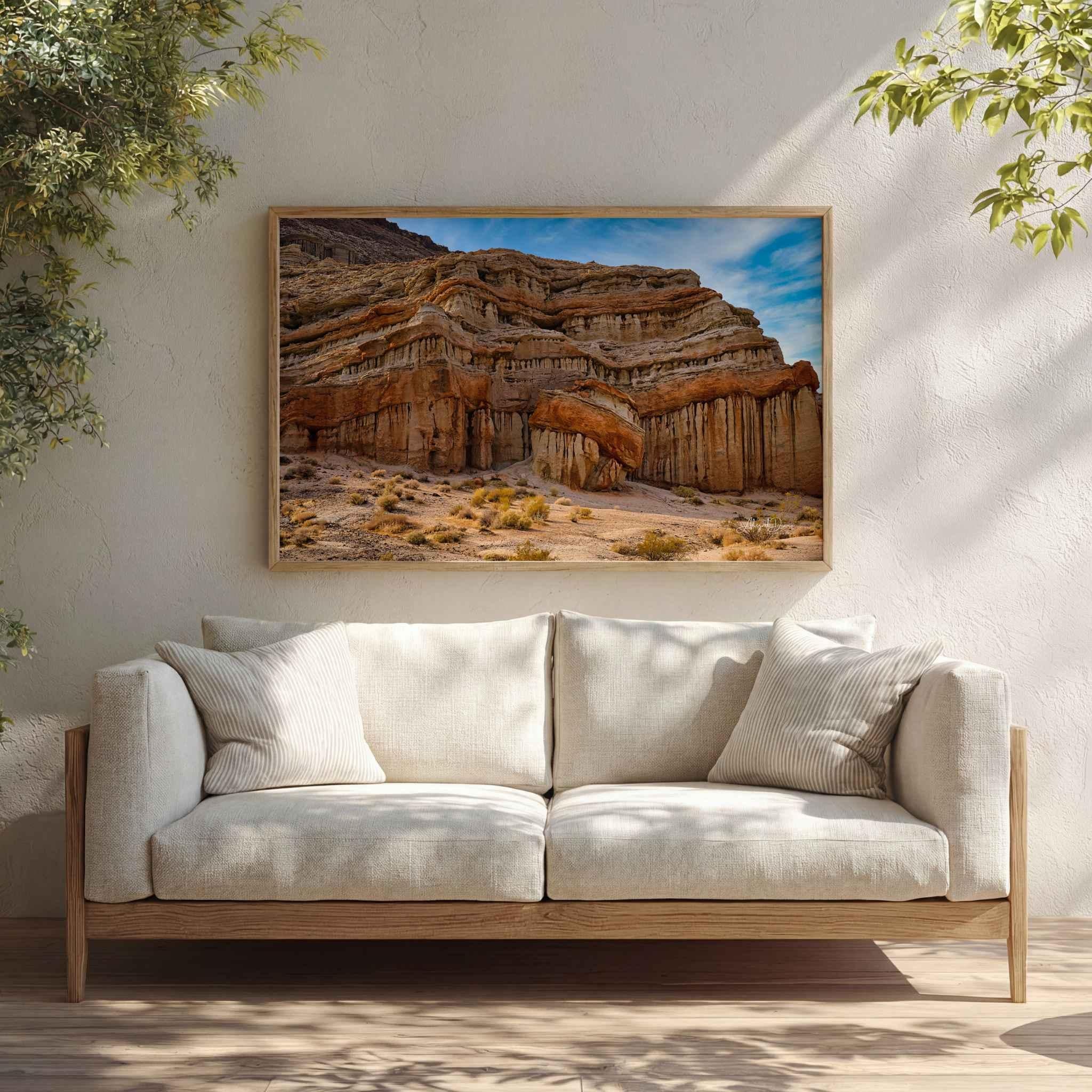 Sculpted in Time Eastern Sierra fine art print displayed in a warm neutral living room above a cream sofa with natural wood accents.