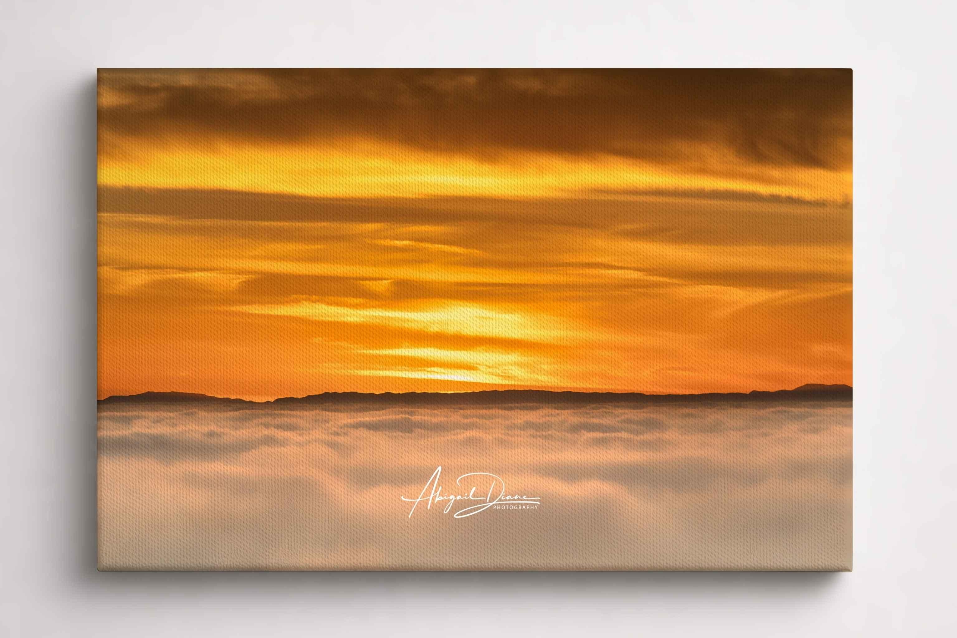 Soaring Above the Clouds gallery-wrapped canvas print featuring a golden winter sunset above a sea of clouds with Catalina Island on the Pacific horizon. Artwork by Abigail Diane Photography