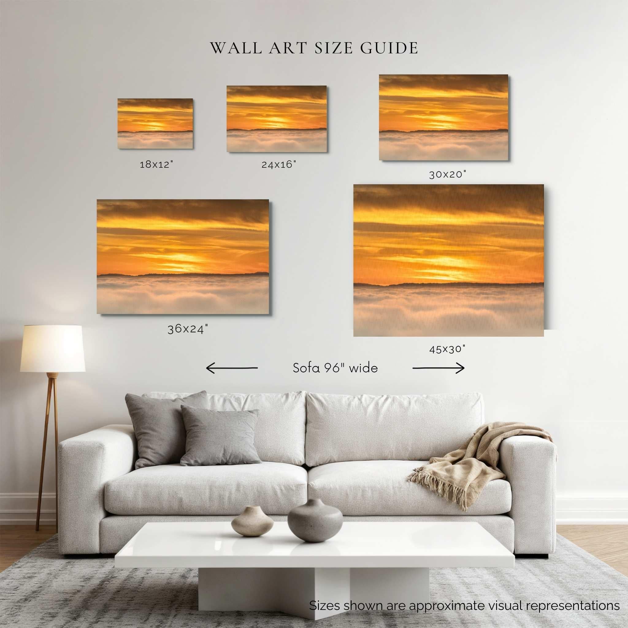 Wall art size guide showing Soaring Above the Clouds gallery-wrapped canvas in 18x12, 24x16, 30x20, 36x24, and 45x30 inch sizes displayed above a 96-inch sofa. Artwork by Abigail Diane Photography.