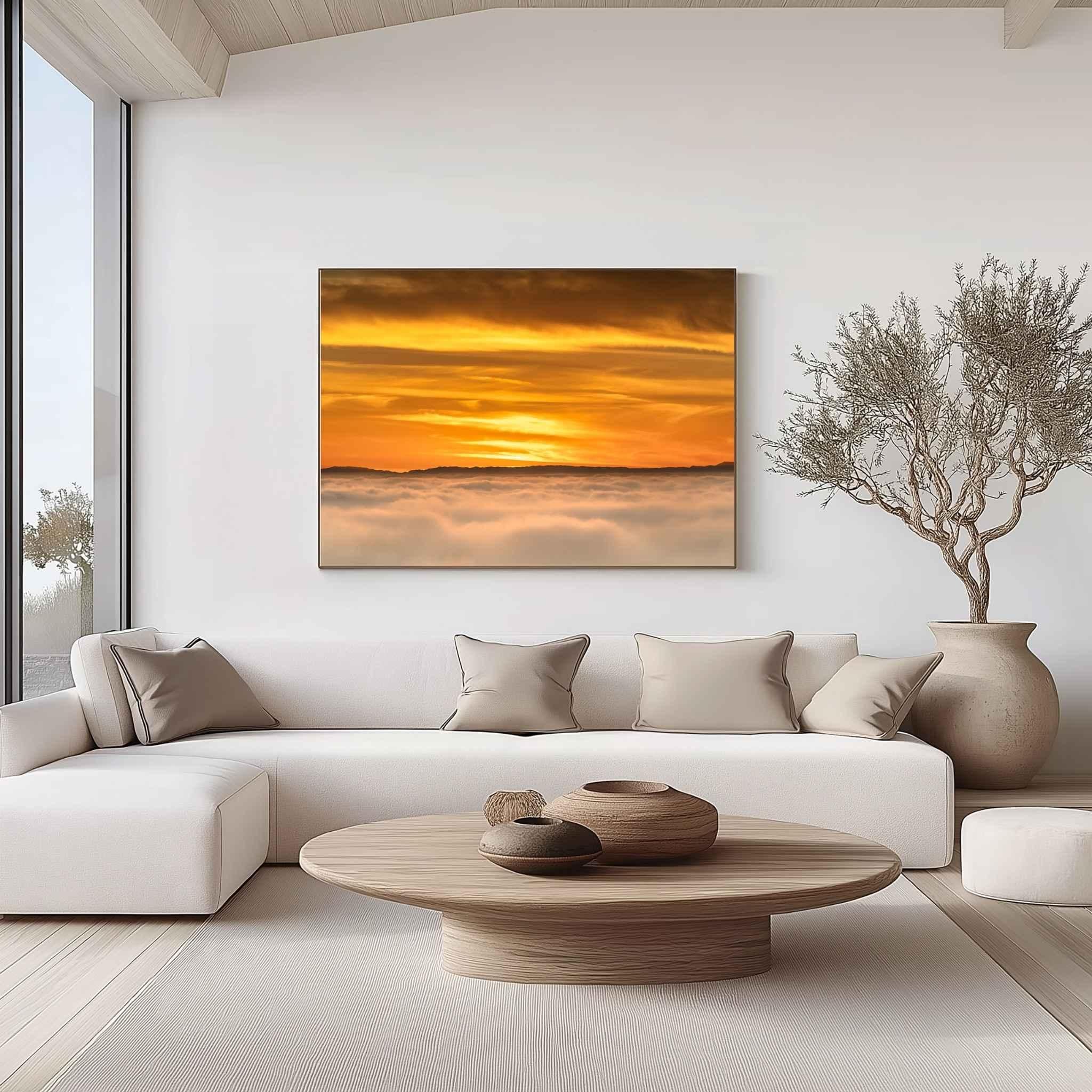 Soaring Above the Clouds gallery-wrapped canvas displayed in a modern living room, featuring a golden winter sunset above a sea of clouds with Catalina Island on the Pacific horizon. Artwork by Abigail Diane Photography.
