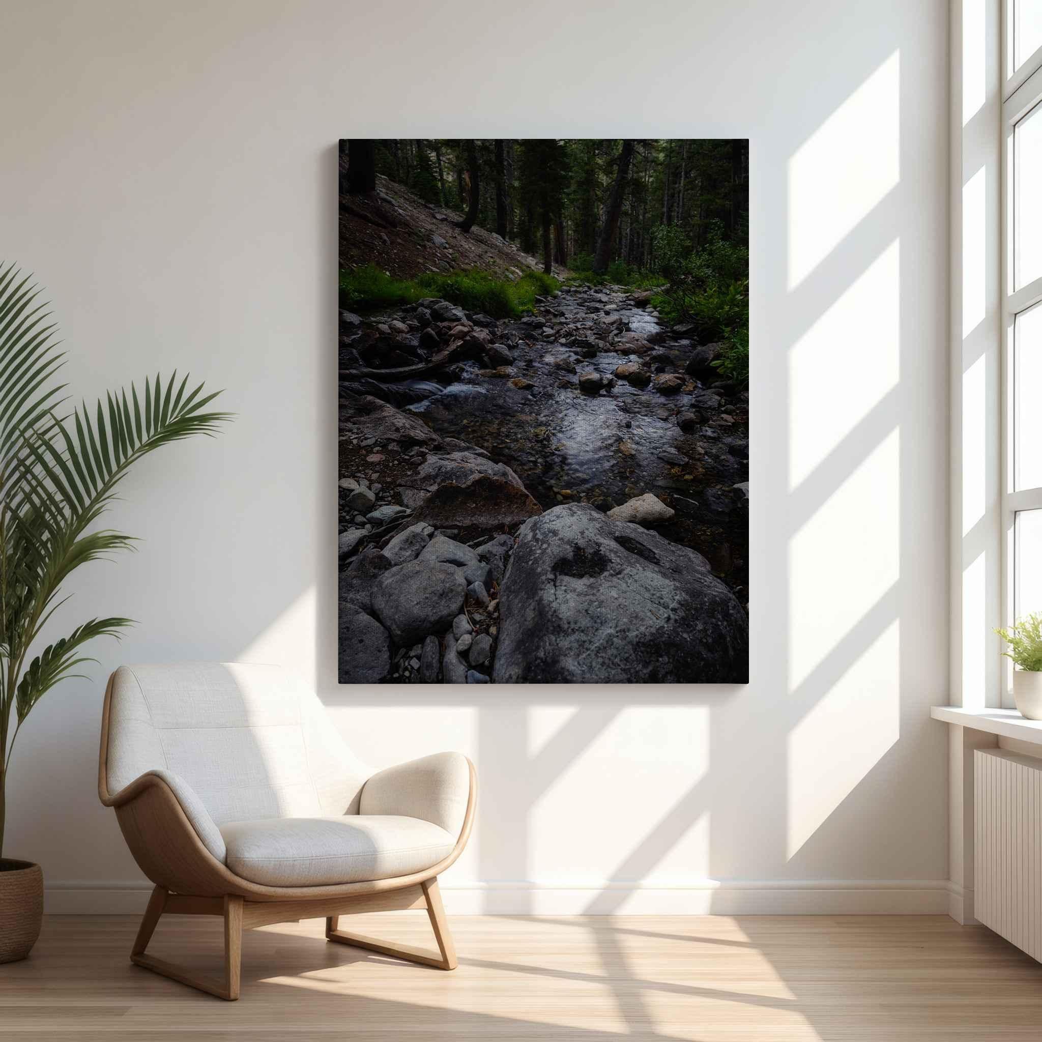 Steady Stream canvas wall art of a rocky creek flowing through the forest near Mammoth Lakes, California, displayed in a bright sunlit interior.