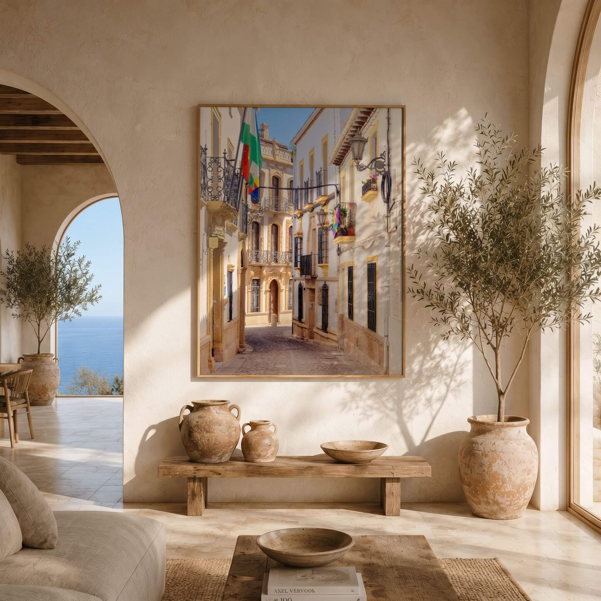 Streets of Ronda framed fine art print displayed in a warm Mediterranean-inspired living room, featuring the historic streets and architecture of Ronda, Spain – Abigail Diane Photography.