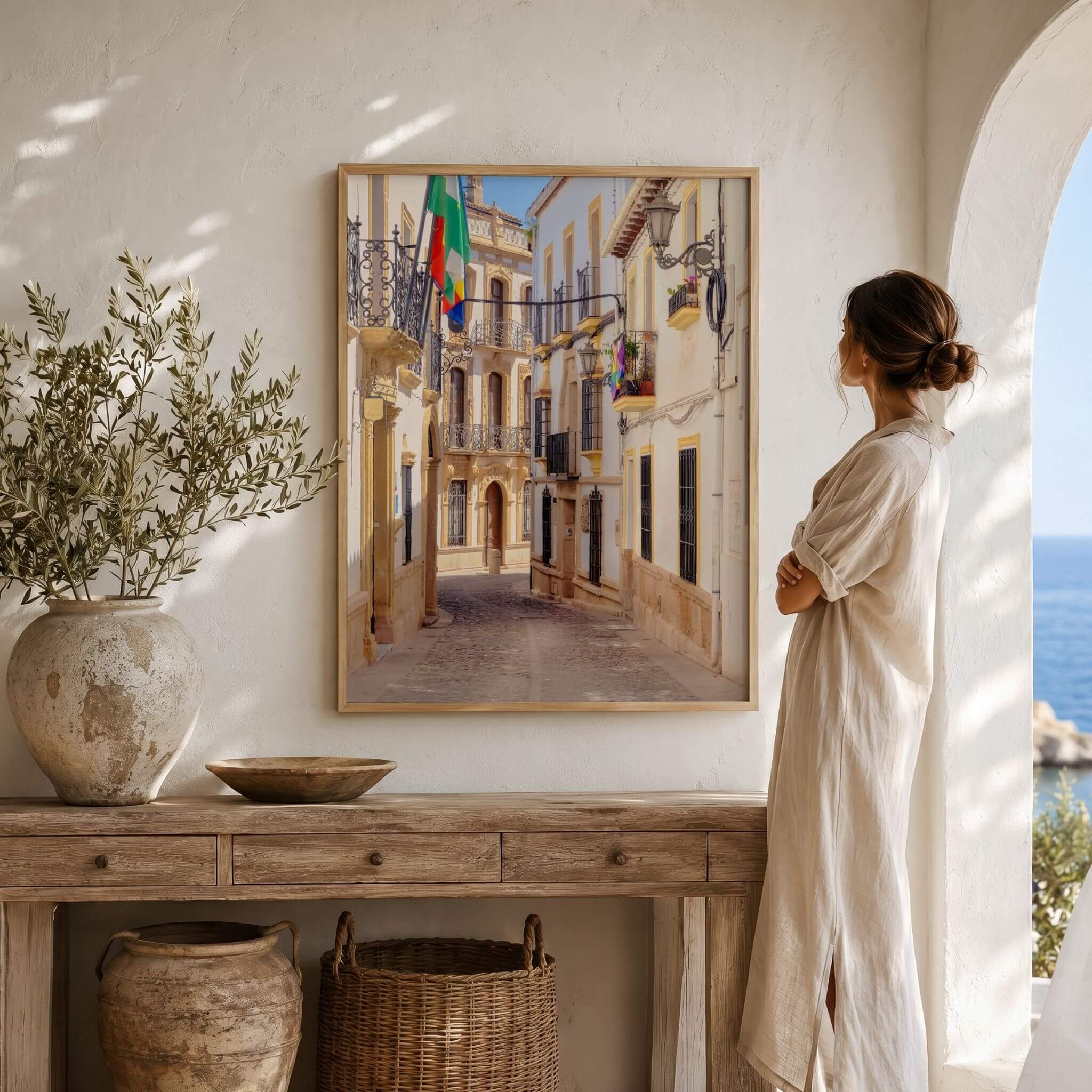 Streets of Ronda framed fine art print displayed in a warm Mediterranean-style interior, featuring historic architecture in Ronda, Spain – Abigail Diane Photography