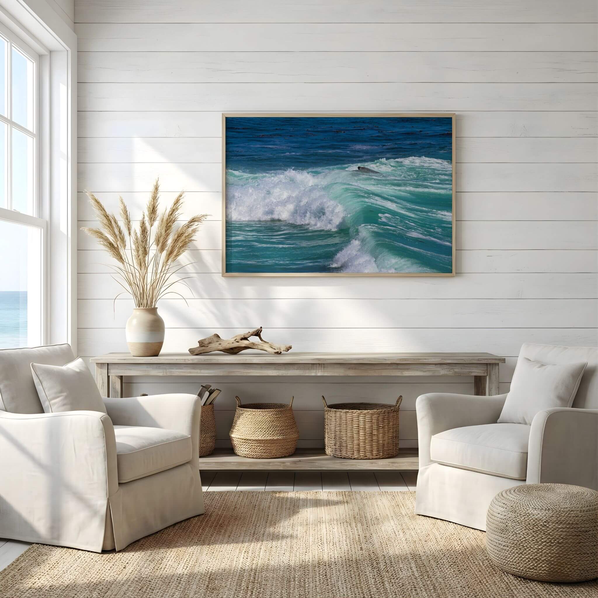 Framed Turquoise Healing Waves artwork displayed in a bright coastal living room, featuring crystal-clear turquoise waves crashing along Laguna Beach on California's Pacific coastline. Nature photography by Abigail Diane Photography.