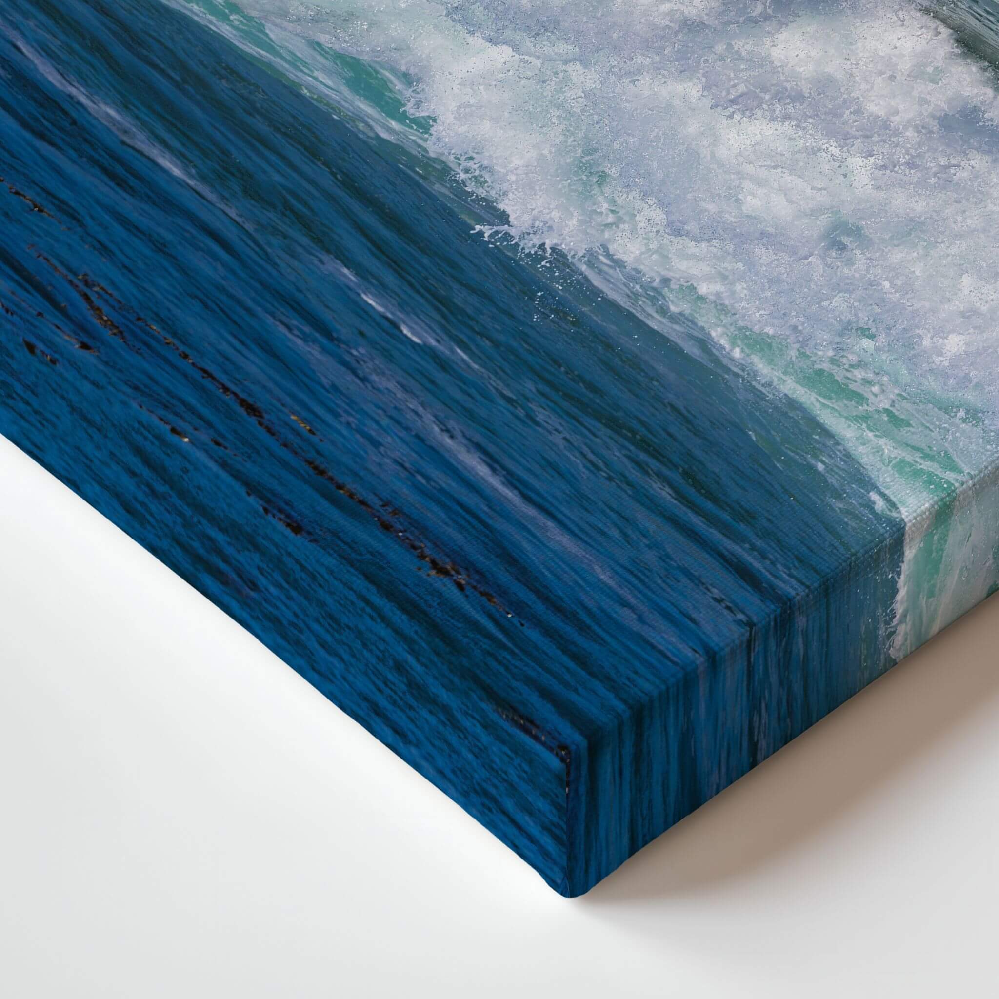 Close-up detail of the gallery-wrapped canvas corner showing Turquoise Healing Waves, highlighting the premium wrapped edges and vivid turquoise Pacific Ocean surf captured at Laguna Beach, California.