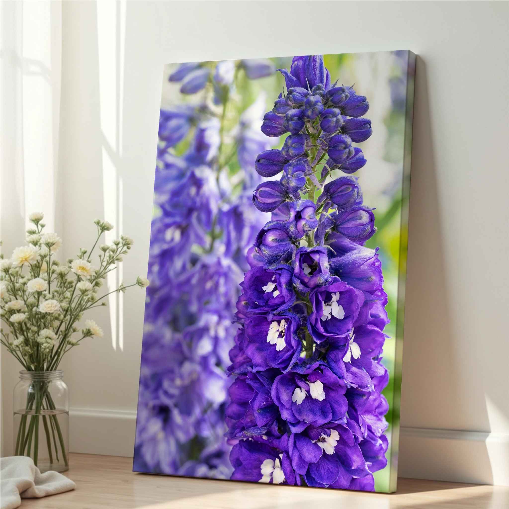 Violet Harmony purple delphinium botanical canvas print shown at an angle with visible gallery-wrapped edges in a softly lit neutral interior – Abigail Diane Photography