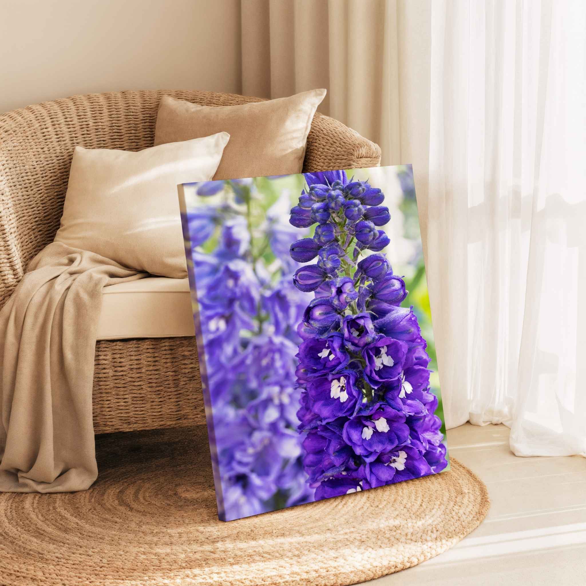 Violet Harmony purple larkspur canvas print displayed beside a woven chair in a warm neutral interior by Abigail Diane Photography.