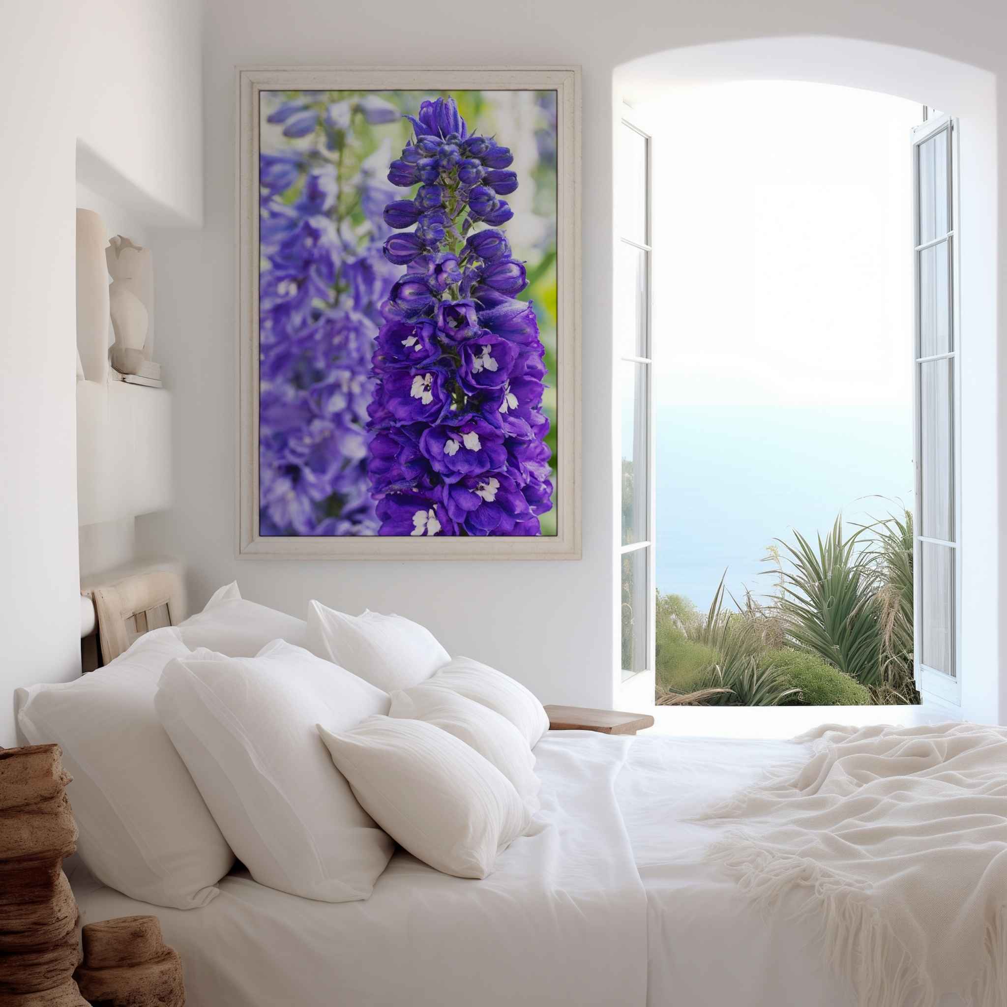 Violet Harmony purple larkspur framed fine art print displayed in a bright coastal bedroom with neutral décor by Abigail Diane Photography.