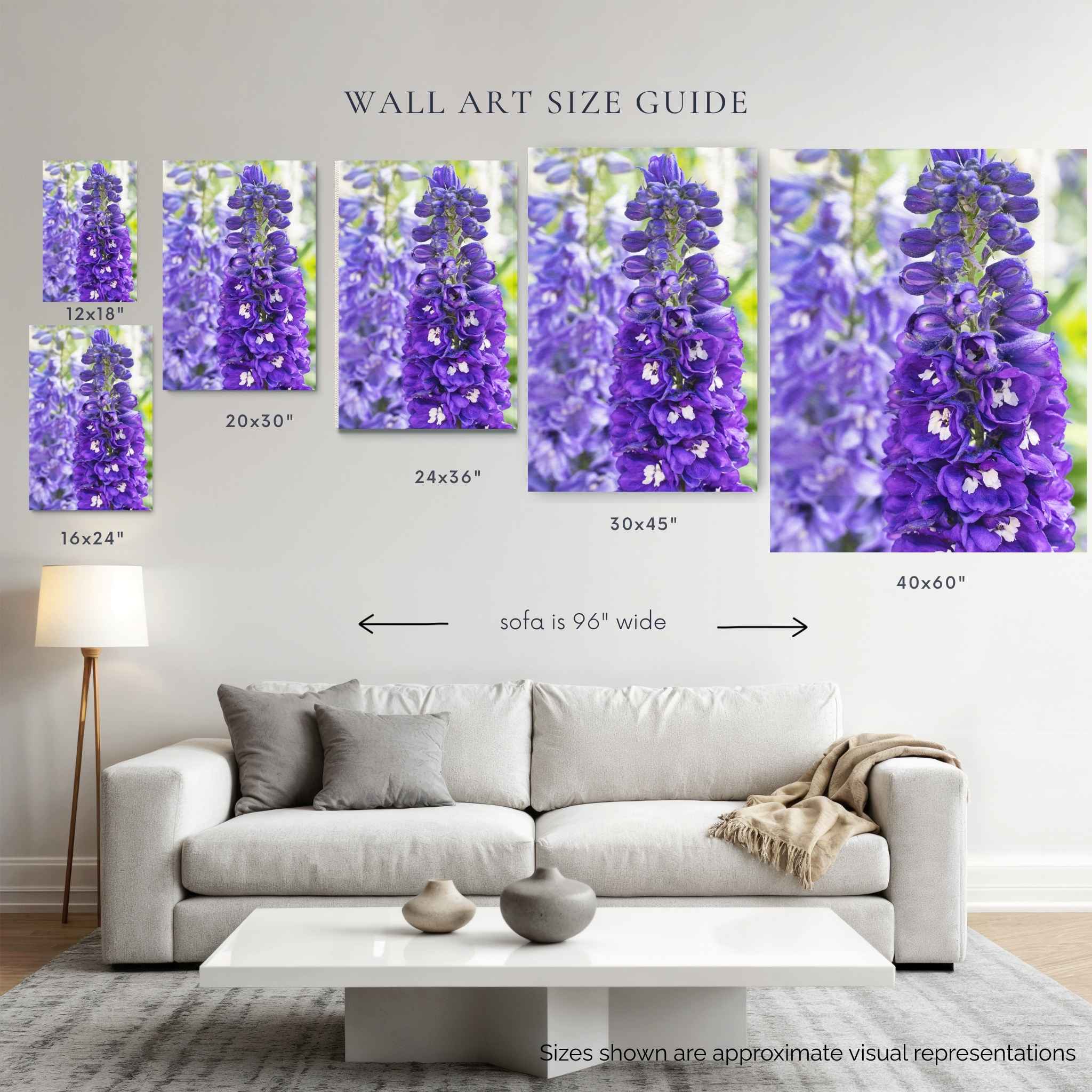 Violet Harmony purple larkspur wall art size guide showing larger print sizes from 12x18 to 40x60 inches above a 96-inch sofa by Abigail Diane Photography.