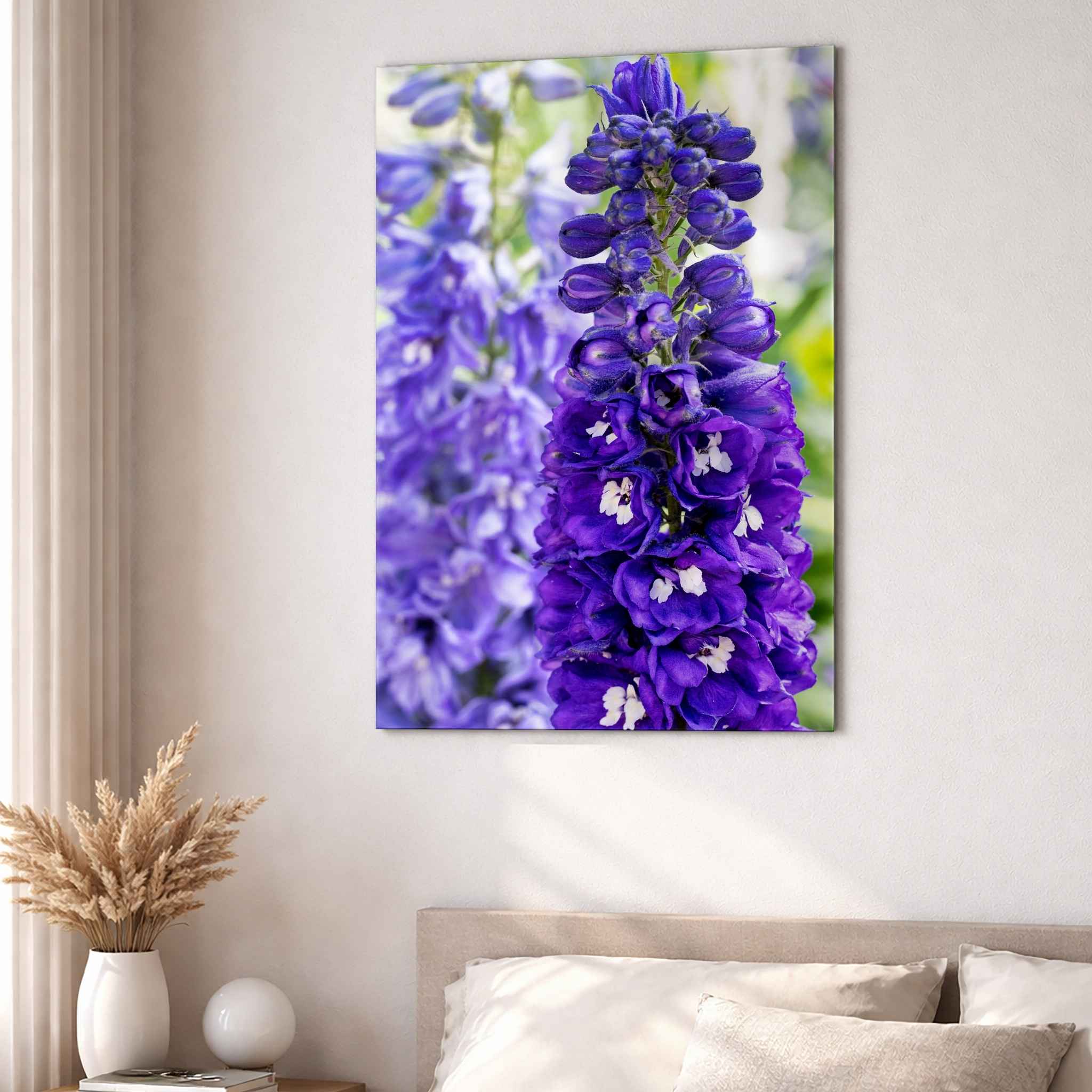 Violet Harmony purple larkspur HD metal print displayed above a neutral upholstered bed in a bright contemporary bedroom by Abigail Diane Photography.
