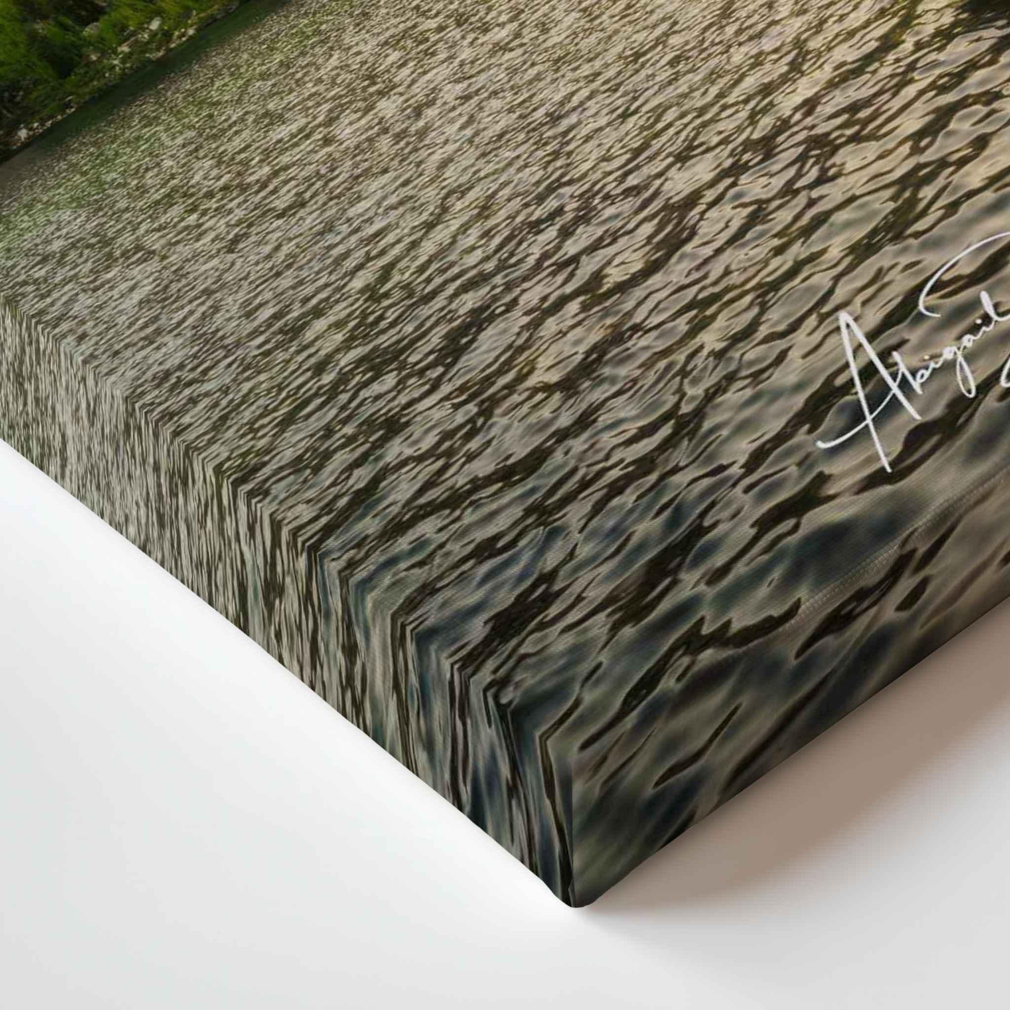 Close-up corner detail of Waiting for the Water canvas print, showing the gallery-wrapped edge, textured lake reflections, and signature detail from Mammoth Lakes, California.