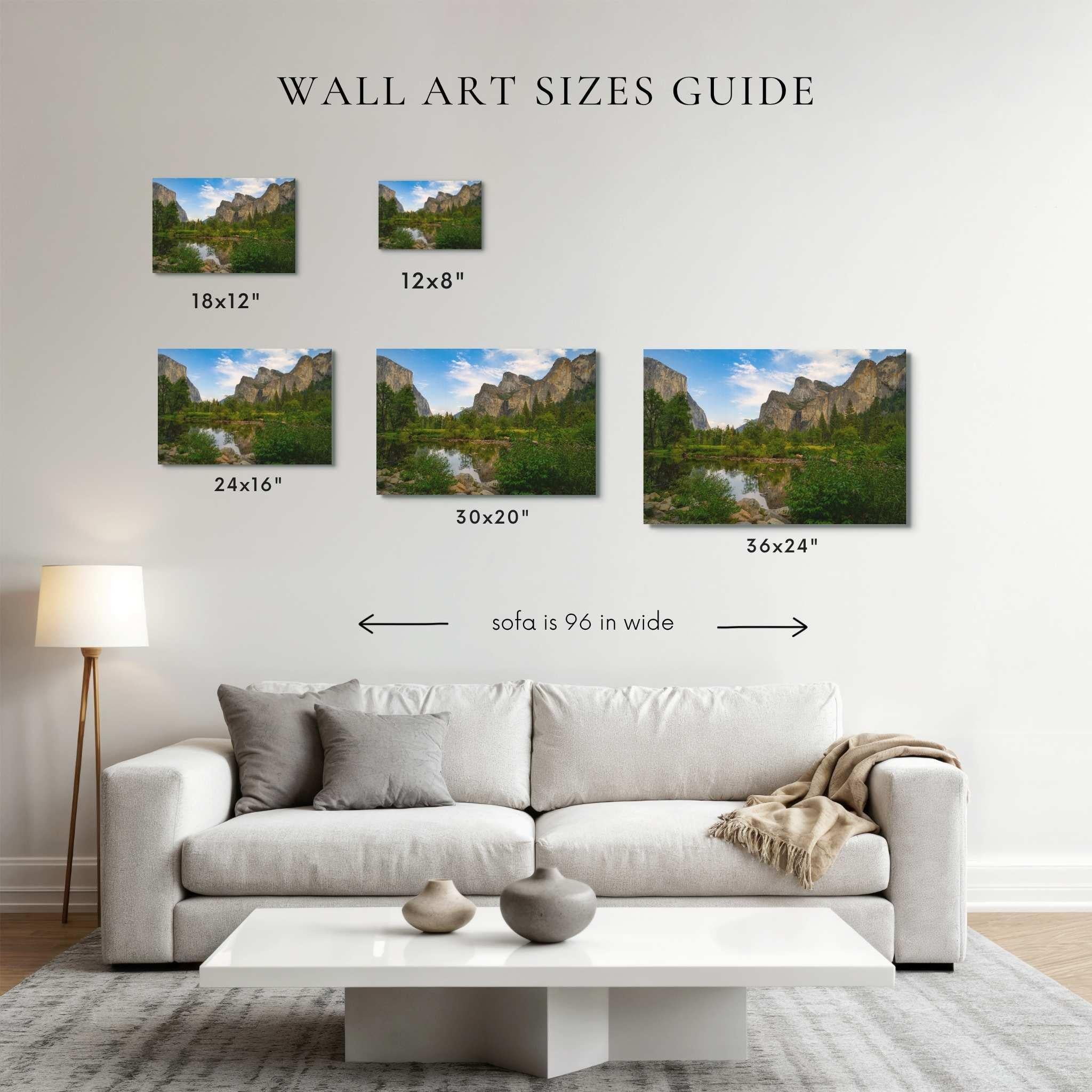 Wall art size guide comparing 12x8, 18x12, 24x16, 30x20, and 36x24 landscape prints above a 96-inch sofa, helping customers choose the right artwork size for their home by Abigail Diane Photography.