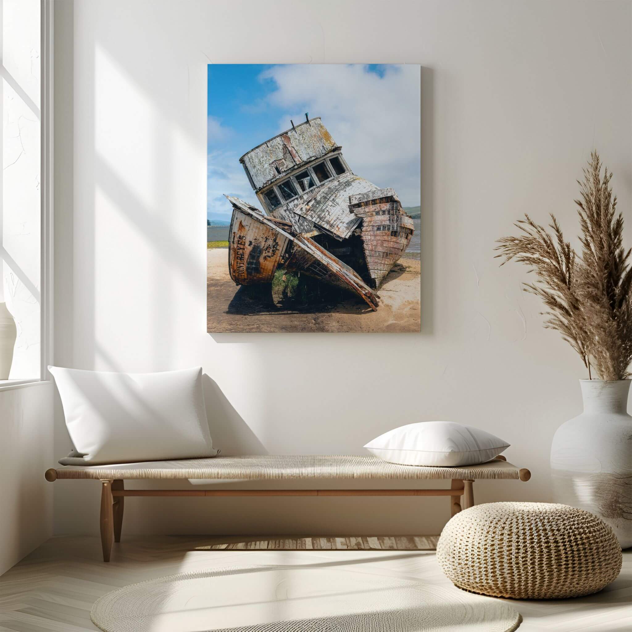 Weathered Echoes Point Reyes shipwreck metal print displayed above a minimalist bench in a serene neutral interior with natural textures.