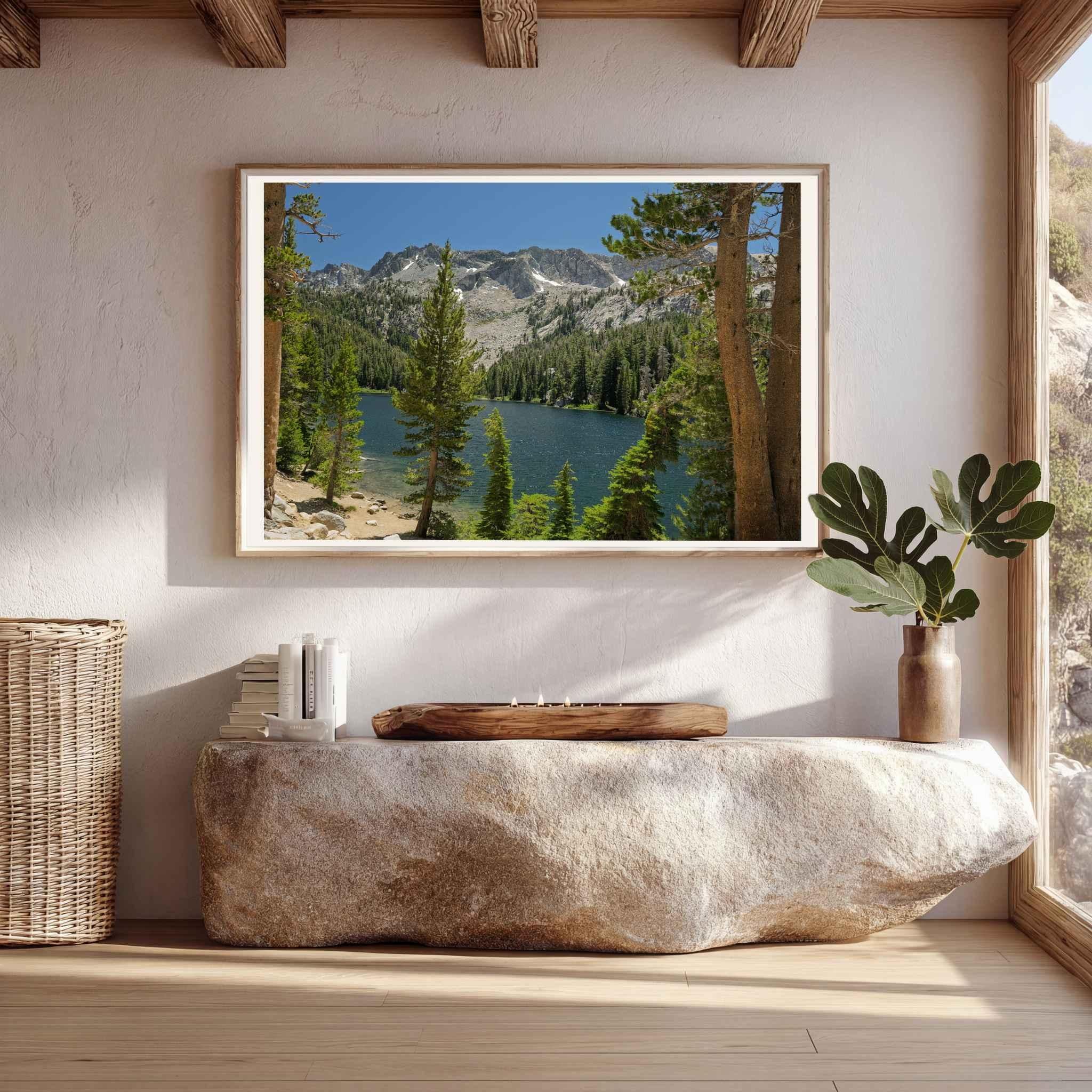 Where the Trail Gives Way to Still Waters framed print displayed above a stone console, featuring an Eastern Sierra alpine lake and mountain landscape near Mammoth Lakes, California.