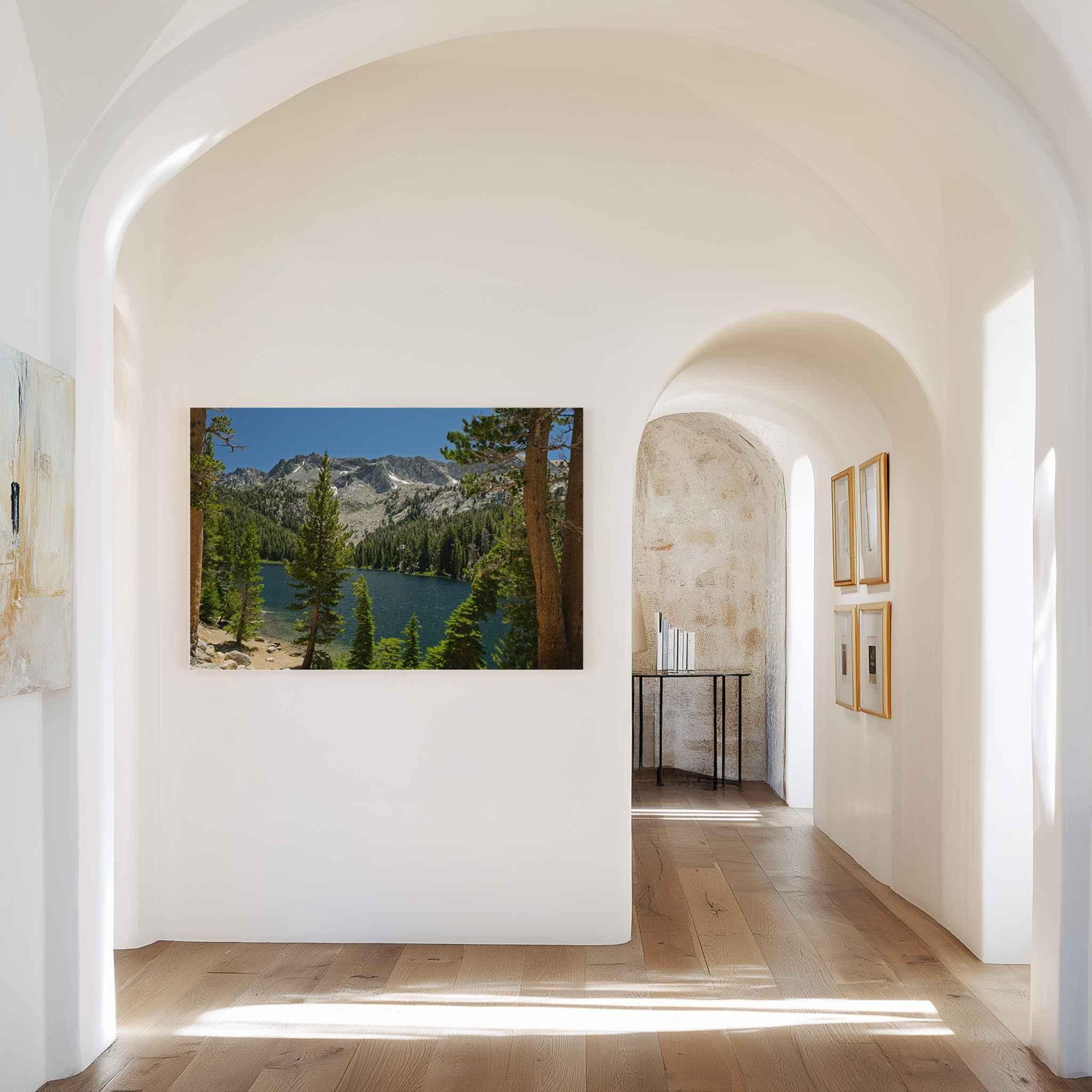 Where the Trail Gives Way to Still Waters metal print displayed in a bright arched hallway, featuring an Eastern Sierra alpine lake landscape near Mammoth Lakes, California.