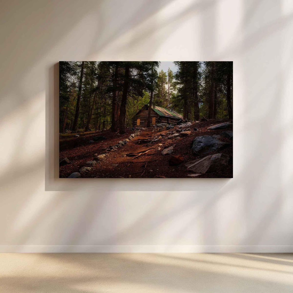 Where the Trail Meets the Past canvas print featuring historic Mahan Cabin near Mammoth Lakes in California’s Eastern Sierra, displayed on a softly lit neutral wall.