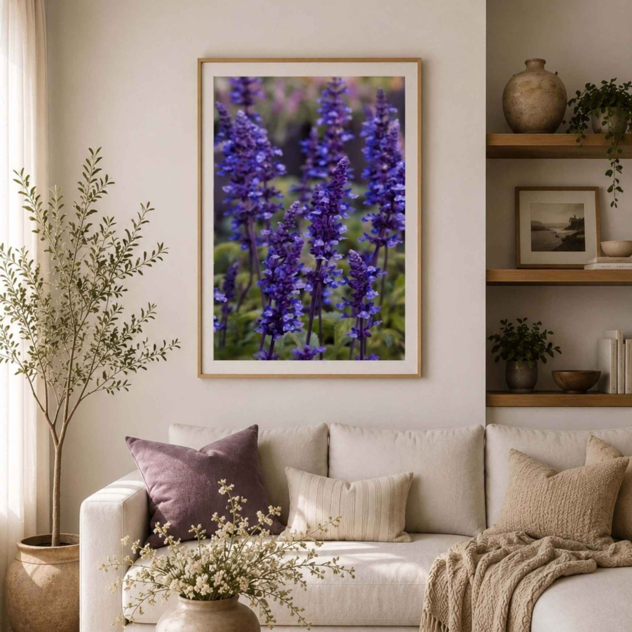 Purple salvia floral print titled Where the Wildflowers Dream by Abigail Diane Photography styled above a neutral sofa with organic textures, natural wood shelving, and calming botanical décor.