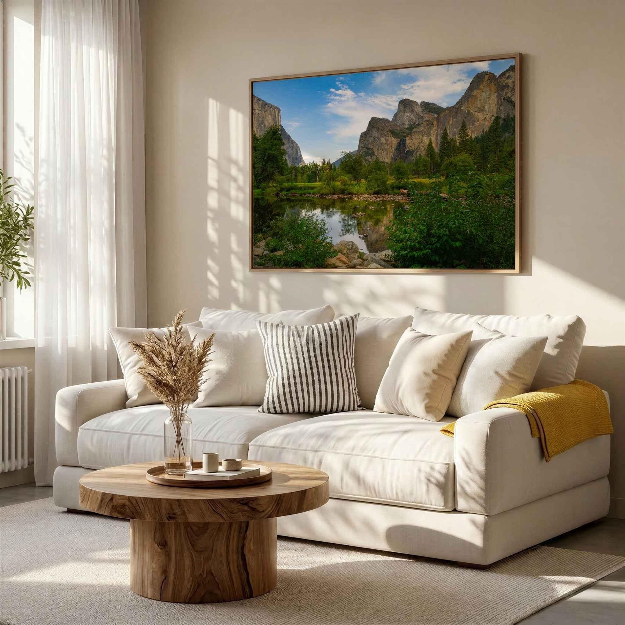 Framed Yosemite Valley fine art print by Abigail Diane Photography displayed Framed Yosemite Valley fine art print by Abigail Diane Photography displayed above a white sofa in a bright luxury living room with natural oak furniture, soft neutral décor, and warm afternoon light.